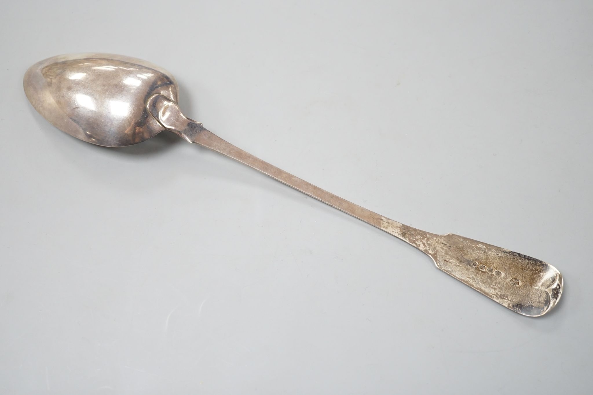 A George III silver fiddle pattern basting spoon, William Seaman, London, 1816, 31.5cm, 109 grams.